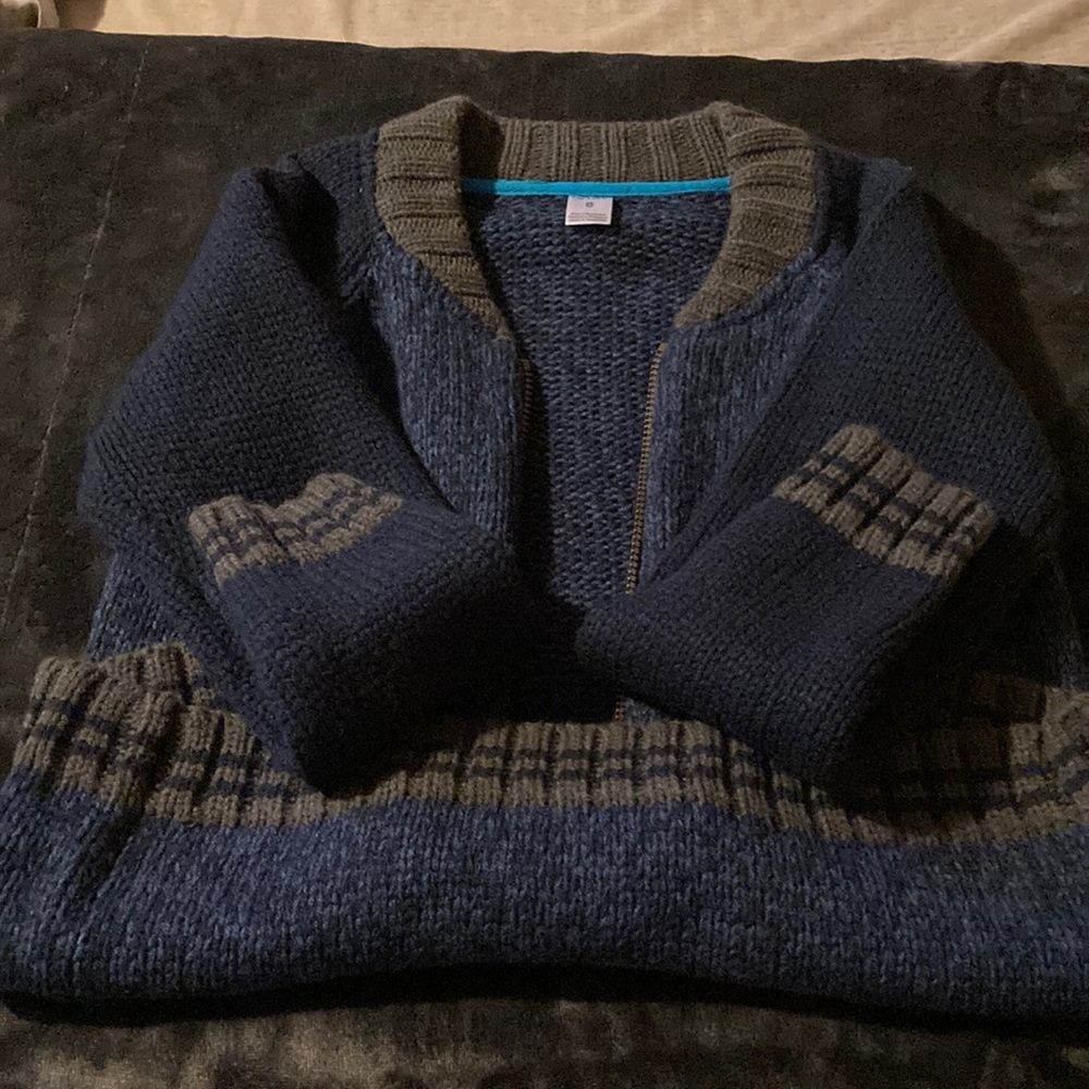 Carter’s zip down sweater.  Boys size 8